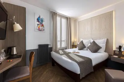 Un ou plusieurs lits dans un hébergement de l'établissement Contact Hôtel Alizé Montmartre