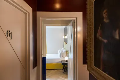 Un ou plusieurs lits dans un hébergement de l'établissement Hôtel Maison Malesherbes