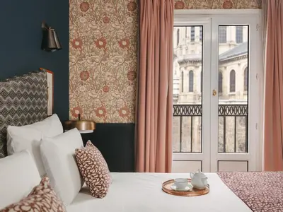 Un ou plusieurs lits dans un hébergement de l'établissement Hôtel Maison Malesherbes
