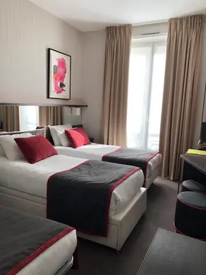 Un ou plusieurs lits dans un hébergement de l'établissement Hôtel Charing Cross