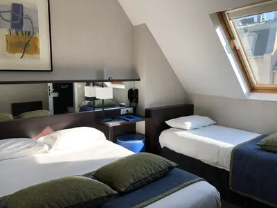 Un ou plusieurs lits dans un hébergement de l'établissement Hôtel Charing Cross