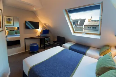 Un ou plusieurs lits dans un hébergement de l'établissement Hôtel Charing Cross
