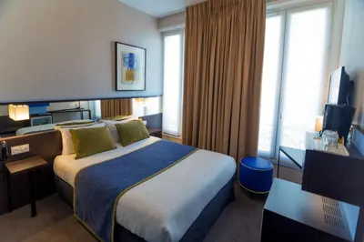 Un ou plusieurs lits dans un hébergement de l'établissement Hôtel Charing Cross
