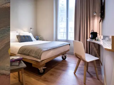 Un ou plusieurs lits dans un hébergement de l'établissement Hotel Max