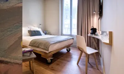 Un ou plusieurs lits dans un hébergement de l'établissement Hotel Max