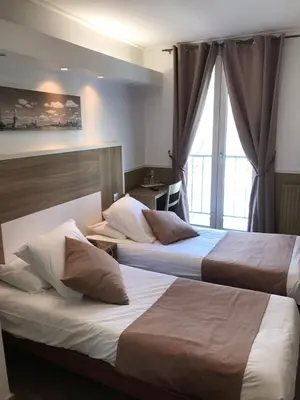 Un ou plusieurs lits dans un hébergement de l'établissement Grand Hotel Nouvel Opera