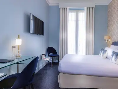 Un ou plusieurs lits dans un hébergement de l'établissement Hotel Claridge Paris