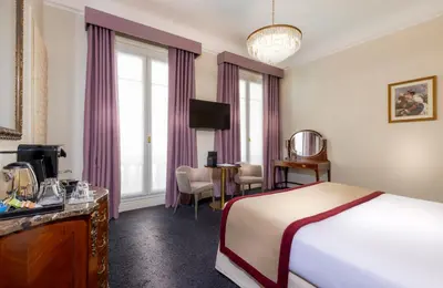 Un ou plusieurs lits dans un hébergement de l'établissement Hotel Claridge Paris