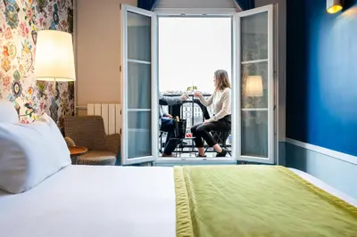 Un ou plusieurs lits dans un hébergement de l'établissement Hôtel Edouard 6 by Malone