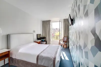 Un ou plusieurs lits dans un hébergement de l'établissement Hôtel Edouard 6 by Malone
