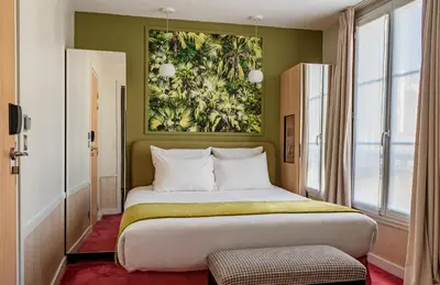Un ou plusieurs lits dans un hébergement de l'établissement Hôtel Edouard 6 by Malone