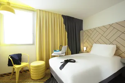 Un ou plusieurs lits dans un hébergement de l'établissement Ibis Styles Paris Massena Olympiades