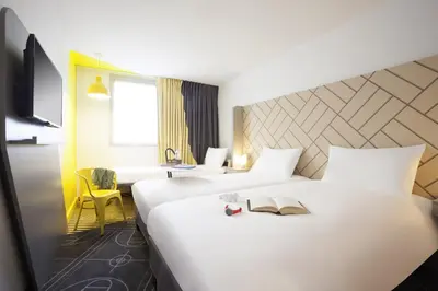 Un ou plusieurs lits dans un hébergement de l'établissement Ibis Styles Paris Massena Olympiades