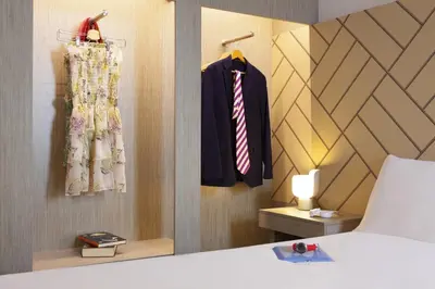 Un ou plusieurs lits dans un hébergement de l'établissement Ibis Styles Paris Massena Olympiades