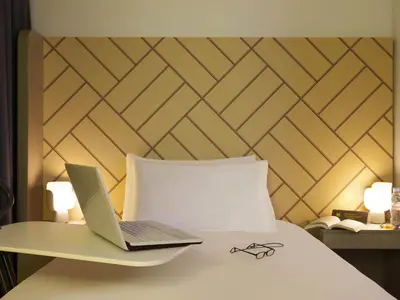 Un ou plusieurs lits dans un hébergement de l'établissement Ibis Styles Paris Massena Olympiades