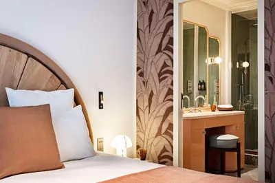 Un ou plusieurs lits dans un hébergement de l'établissement Hotel Florida Paris