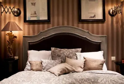 Un ou plusieurs lits dans un hébergement de l'établissement Hôtel Chateaubriand