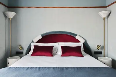 Un ou plusieurs lits dans un hébergement de l'établissement Hôtel Mercedes