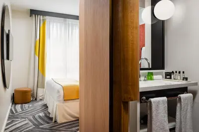 Un ou plusieurs lits dans un hébergement de l'établissement Hôtel du Ministère
