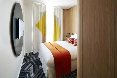 Un ou plusieurs lits dans un hébergement de l'établissement Hôtel du Ministère