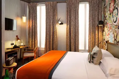 Un ou plusieurs lits dans un hébergement de l'établissement Hôtel Les Dames du Panthéon