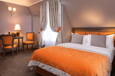 Un ou plusieurs lits dans un hébergement de l'établissement Hotel Residence Henri IV