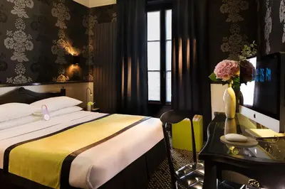 Un ou plusieurs lits dans un hébergement de l'établissement Hotel Design Sorbonne