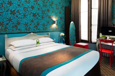 Un ou plusieurs lits dans un hébergement de l'établissement Hotel Design Sorbonne