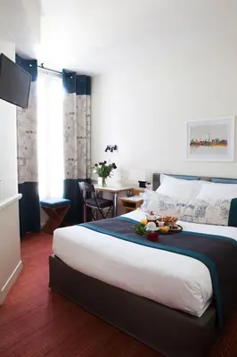 Un ou plusieurs lits dans un hébergement de l'établissement Hotel La Manufacture