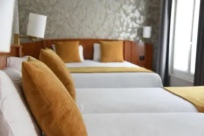 Un ou plusieurs lits dans un hébergement de l'établissement Timhotel Opera Madeleine