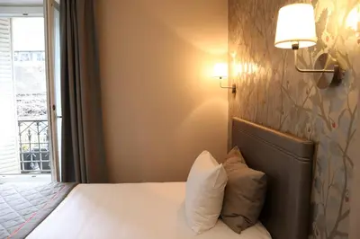 Un ou plusieurs lits dans un hébergement de l'établissement Timhotel Paris Gare Montparnasse