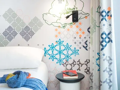Un ou plusieurs lits dans un hébergement de l'établissement Ibis Styles Paris Gare Saint Lazare