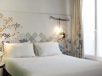 Un ou plusieurs lits dans un hébergement de l'établissement Ibis Styles Paris Gare Saint Lazare