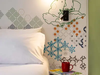 Un ou plusieurs lits dans un hébergement de l'établissement Ibis Styles Paris Gare Saint Lazare