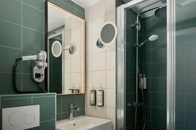 Salle de bains dans l'établissement Timhotel Nation