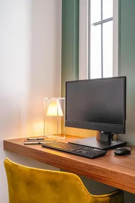 Télévision ou salle de divertissement dans l'établissement Timhotel Tour Eiffel