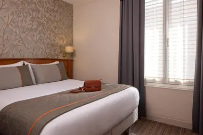 Un ou plusieurs lits dans un hébergement de l'établissement Timhotel Tour Eiffel