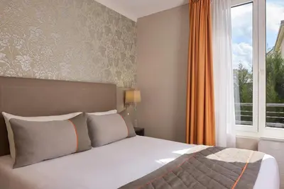 Un ou plusieurs lits dans un hébergement de l'établissement Timhotel Tour Eiffel