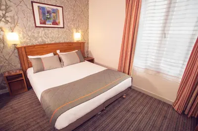 Un ou plusieurs lits dans un hébergement de l'établissement Timhotel Tour Eiffel