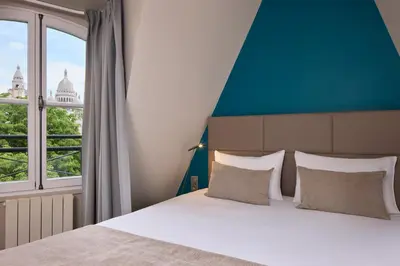 Un ou plusieurs lits dans un hébergement de l'établissement Timhotel Montmartre