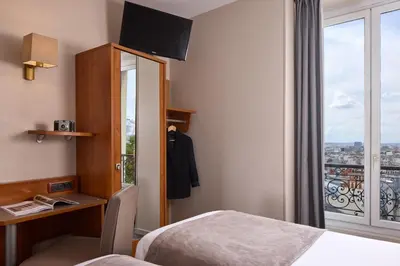 Un ou plusieurs lits dans un hébergement de l'établissement Timhotel Montmartre