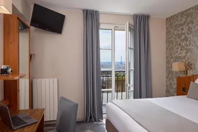 Un ou plusieurs lits dans un hébergement de l'établissement Timhotel Montmartre