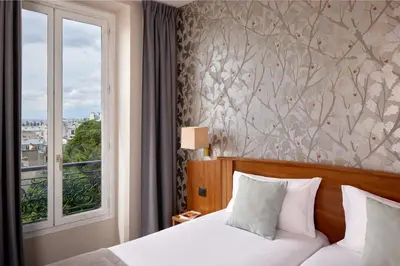 Un ou plusieurs lits dans un hébergement de l'établissement Timhotel Montmartre
