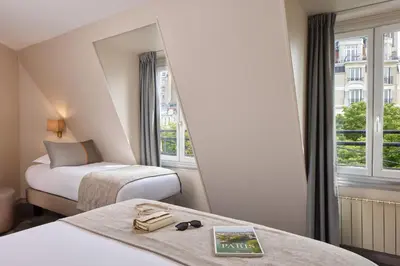 Un ou plusieurs lits dans un hébergement de l'établissement Timhotel Montmartre