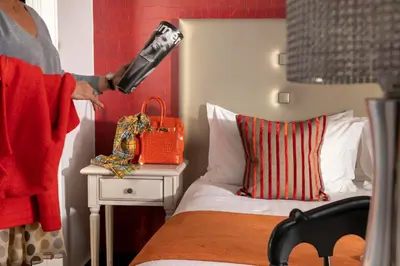 Un ou plusieurs lits dans un hébergement de l'établissement Hotel Plaza Elysées