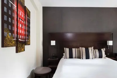 Un ou plusieurs lits dans un hébergement de l'établissement Hôtel Albert 1er Paris Lafayette