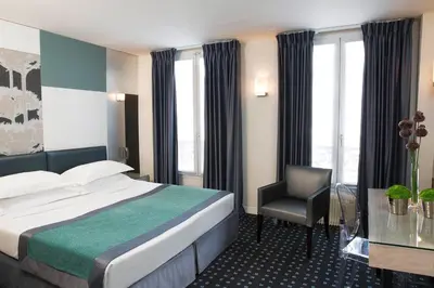 Un ou plusieurs lits dans un hébergement de l'établissement Hôtel A La Villa des Artistes