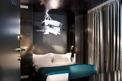 Un ou plusieurs lits dans un hébergement de l'établissement Hôtel A La Villa des Artistes