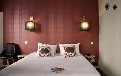 Un ou plusieurs lits dans un hébergement de l'établissement Hotel France Albion