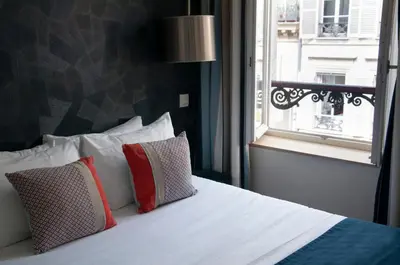 Un ou plusieurs lits dans un hébergement de l'établissement Hotel France Albion